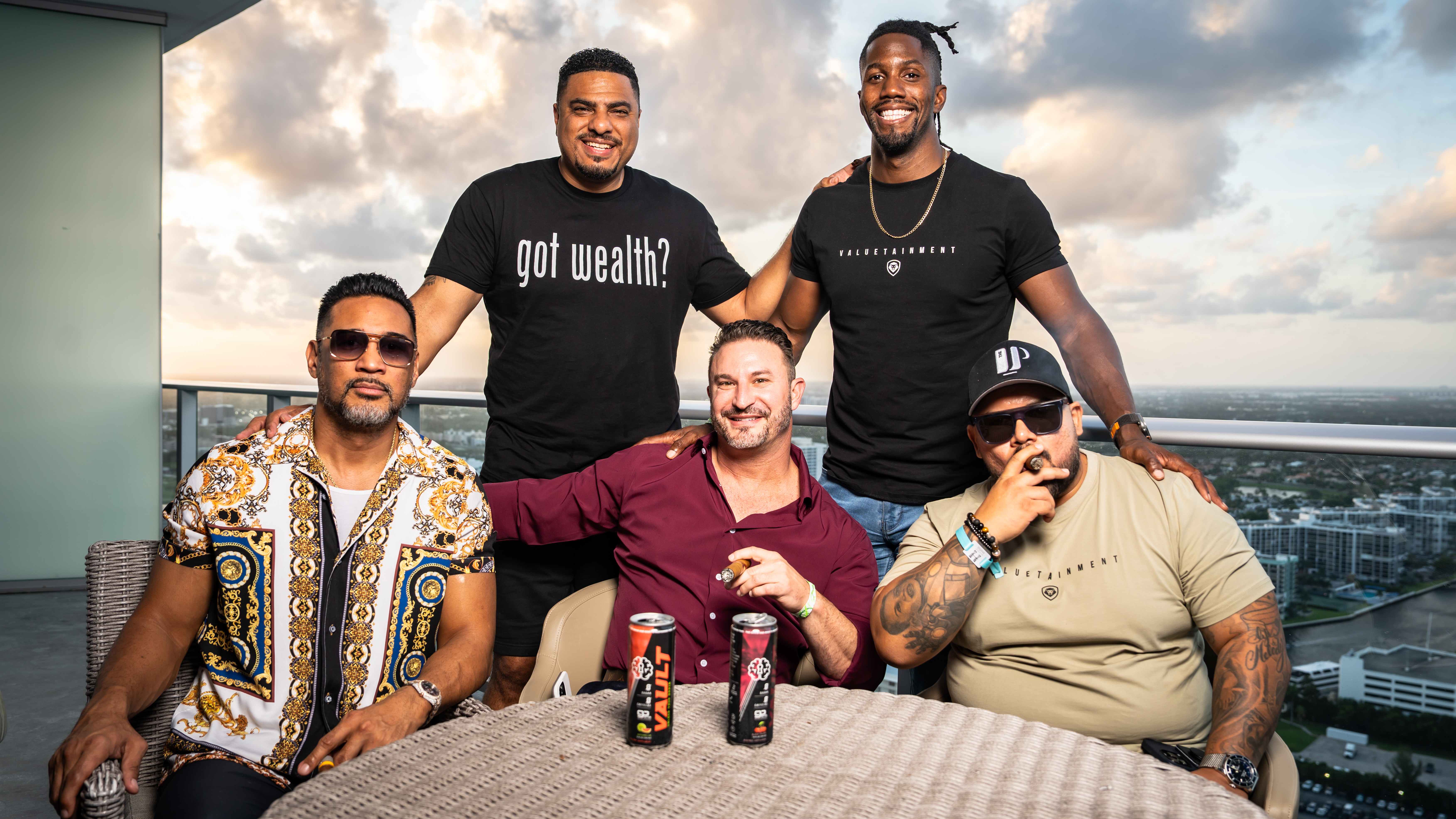 Group portrait on high-rise balcony at sunset
