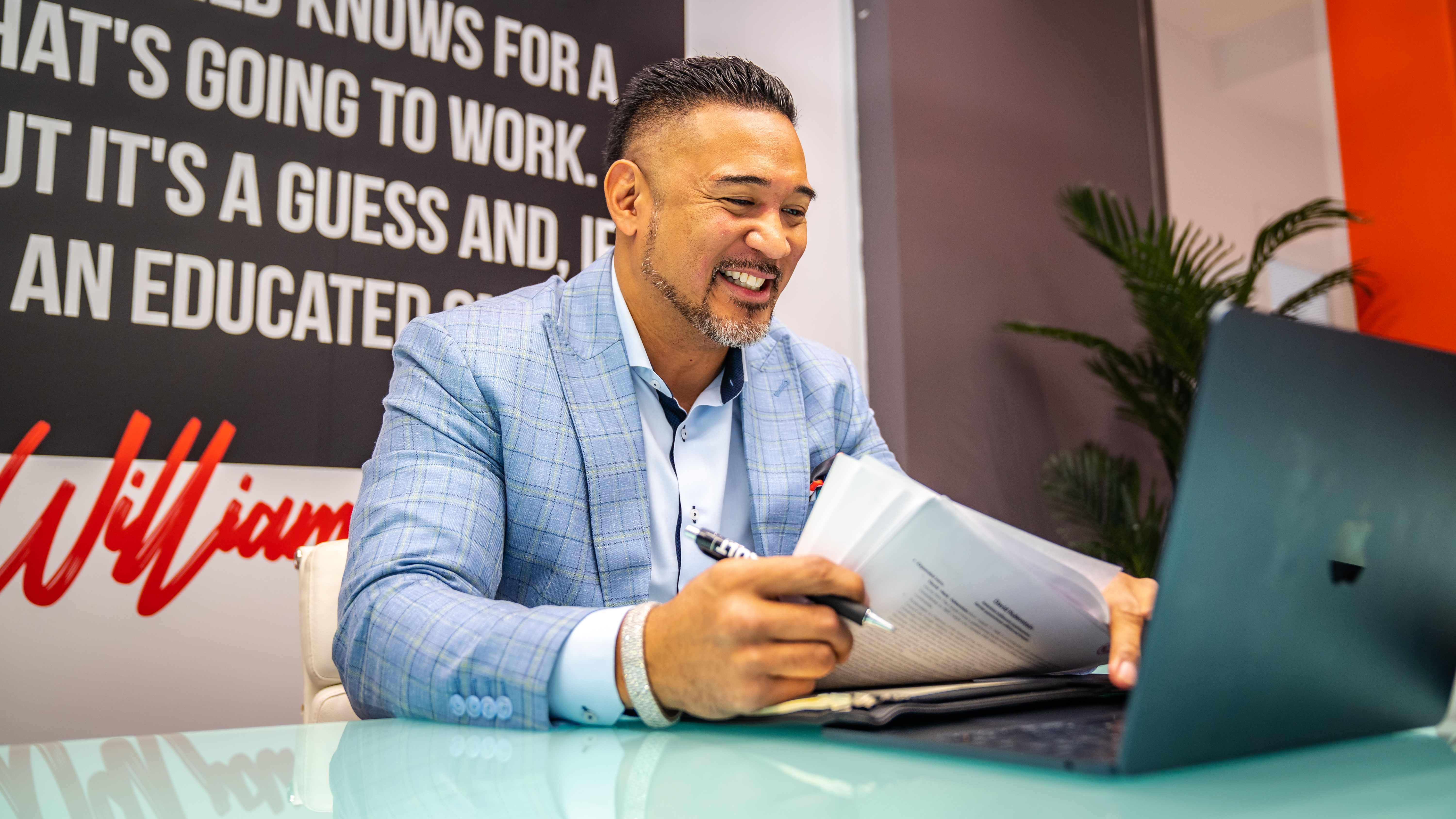 Executive reviewing documents at office desk